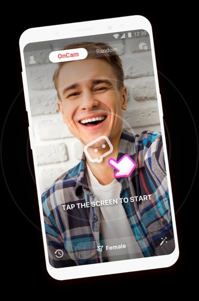 A man smiling while on a 1v1 video chat through the fachat app on his phone.